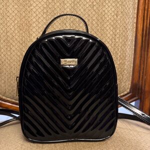 Harrods Elegant Black Quilted Backpack. Condition: Like new.